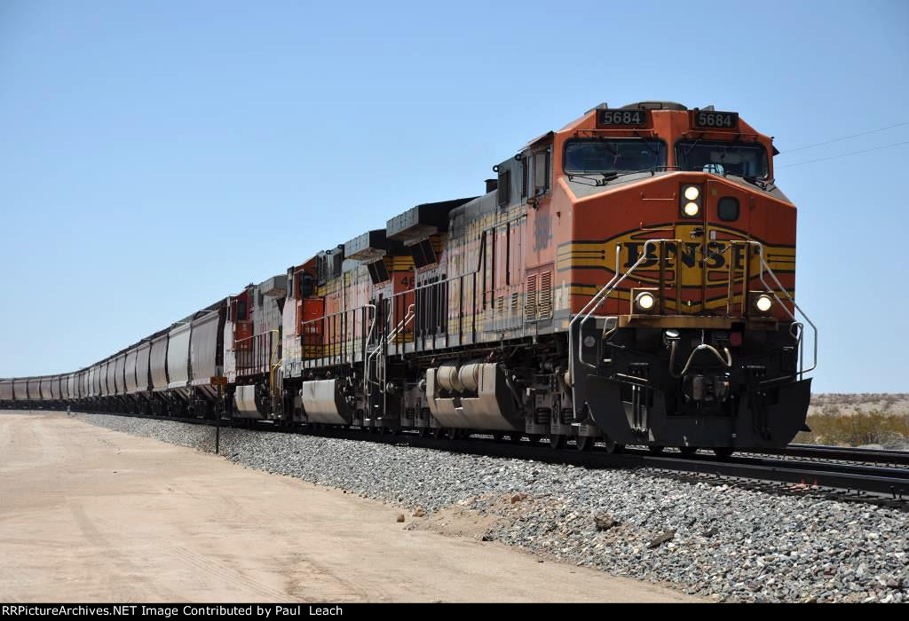 Grain train rolls east down the grade